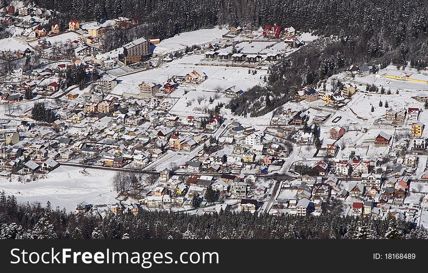 A small city covered with snow during winter. A small city covered with snow during winter