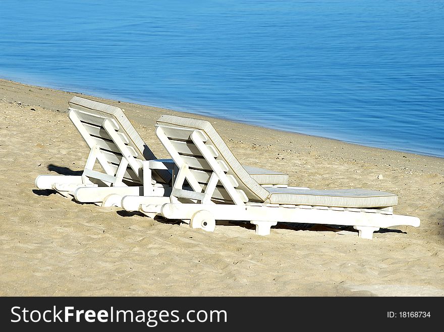 Two sundecks on the beach, facing the sea