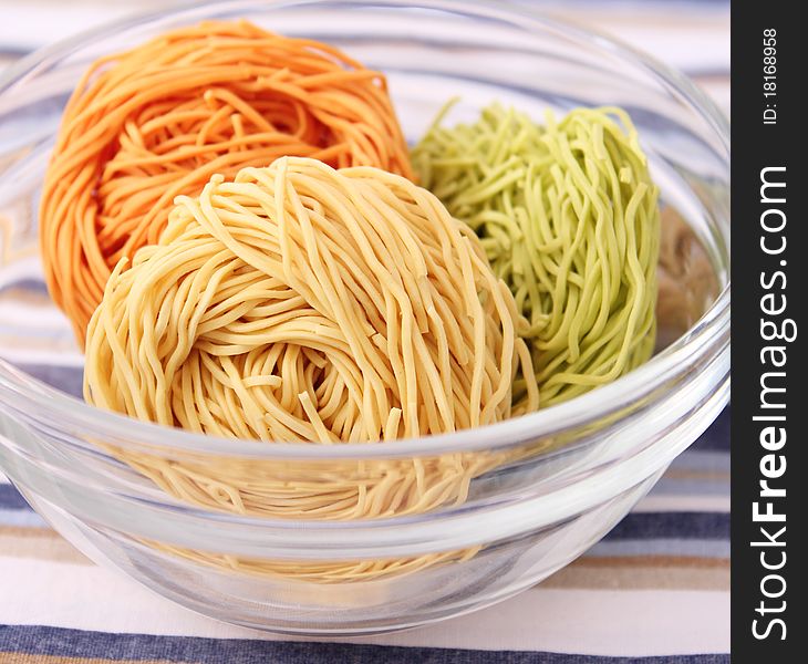 Some raw colourful noodles for cooking a soup