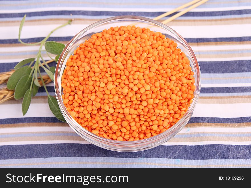 Some dried red lentils in a bowl