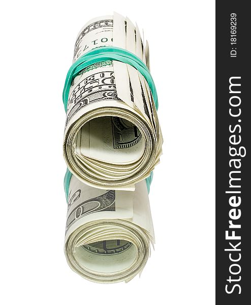 Roll of money wrapped with an elastic on a mirror. Roll of money wrapped with an elastic on a mirror