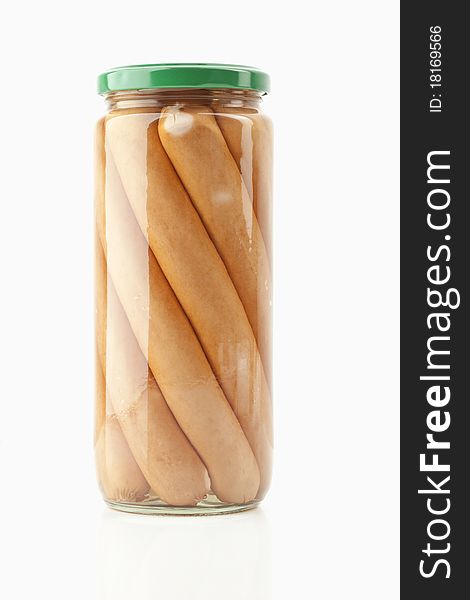 Sausages in a glass on white background