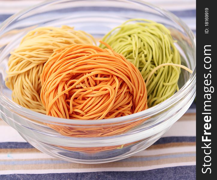 Some raw colourful noodles for cooking a soup