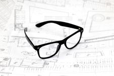 Black Glasses On The Architectural Blueprints Royalty Free Stock Photo