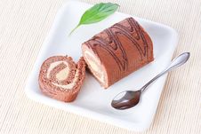 Swiss Roll With Milk Cream And A Green Leaf Royalty Free Stock Photos Swiss Roll With Milk Cream And A Green Leaf Royalty Free Stock Photos