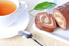 Swiss Roll With Milk Cream And A Cup Of Tea Royalty Free Stock Images