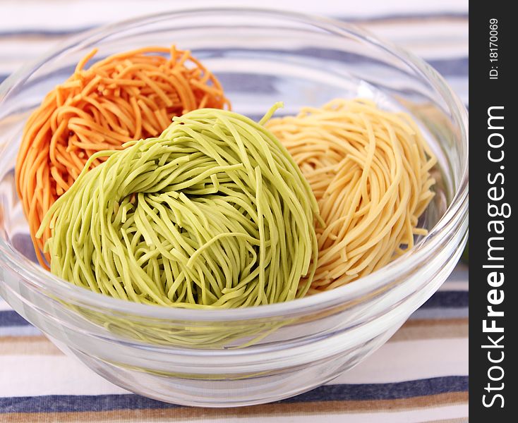 Some raw colourful noodles for cooking a soup