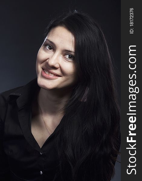 Portrait of beautiful brunette woman in studio