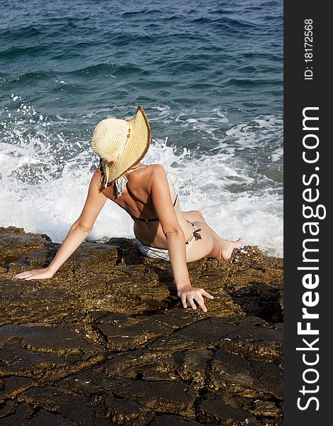 Woman with hat sunbathing