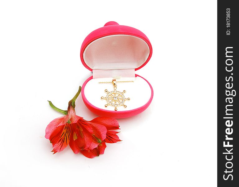 Pendant form of heart in a red box astromeria lily. Pendant form of heart in a red box astromeria lily