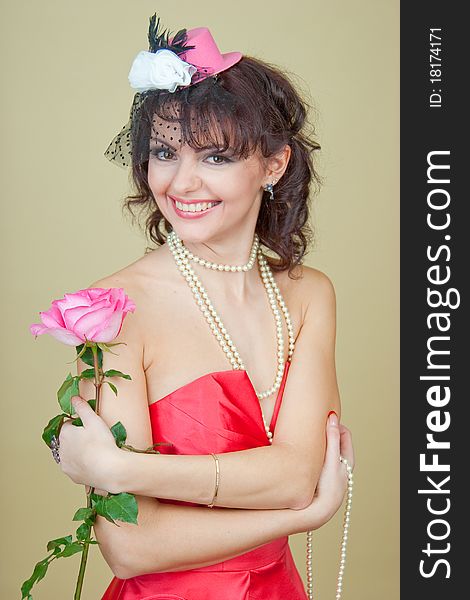 Beautiful girl in pink hat with veil