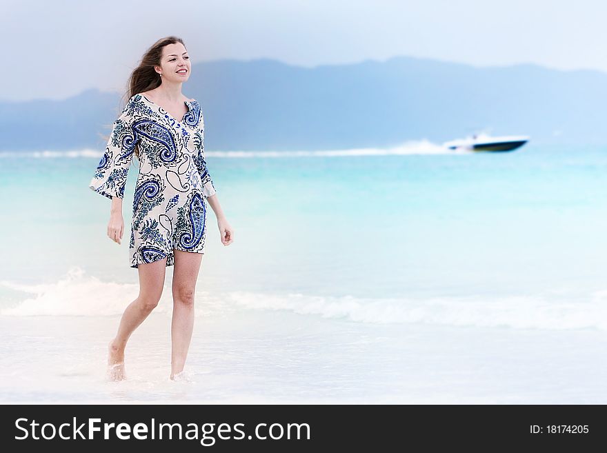 Young attractive woman walking on beach. Young attractive woman walking on beach