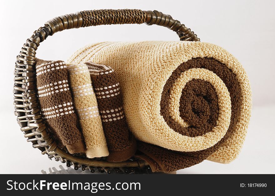 Rolled up bath towels in a basket. Rolled up bath towels in a basket.