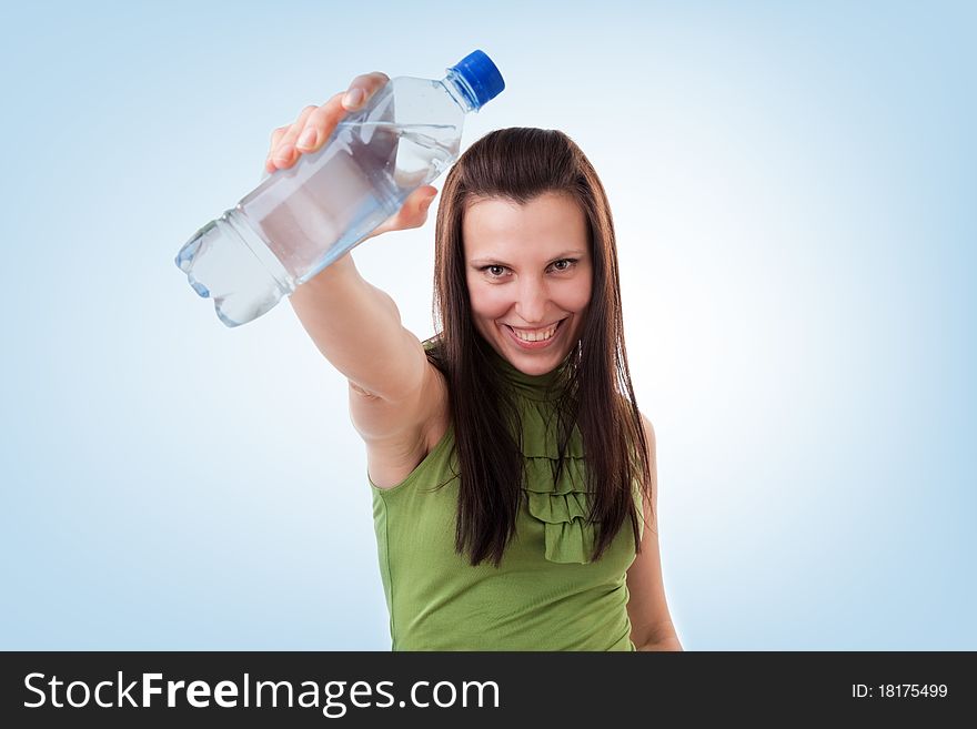 Young woman drinking bottled mineral water. Young woman drinking bottled mineral water