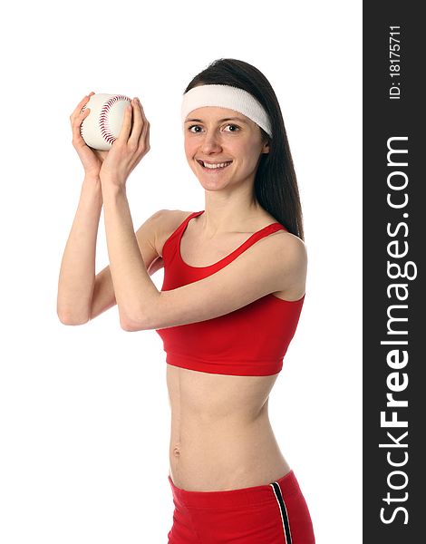 Happy young woman in red sport clothes exercising with a small ball; isolated on white. Happy young woman in red sport clothes exercising with a small ball; isolated on white