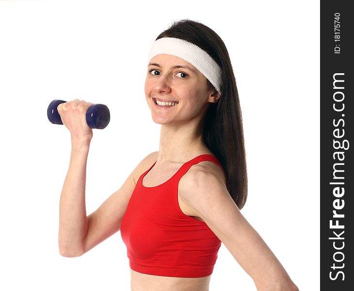 Happy Young Woman Exercising With A Dumbbell