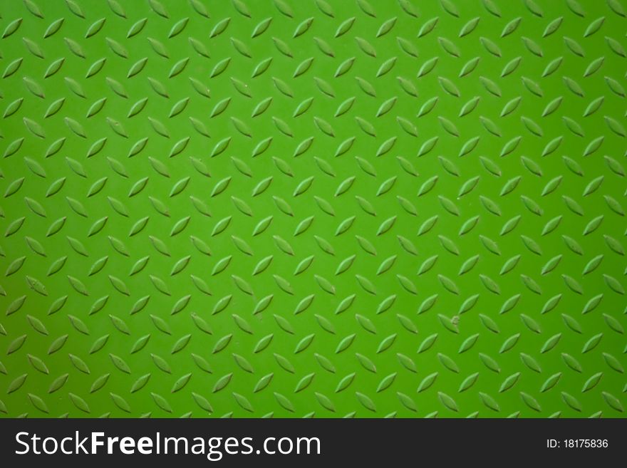 The vivid green metal plank surface