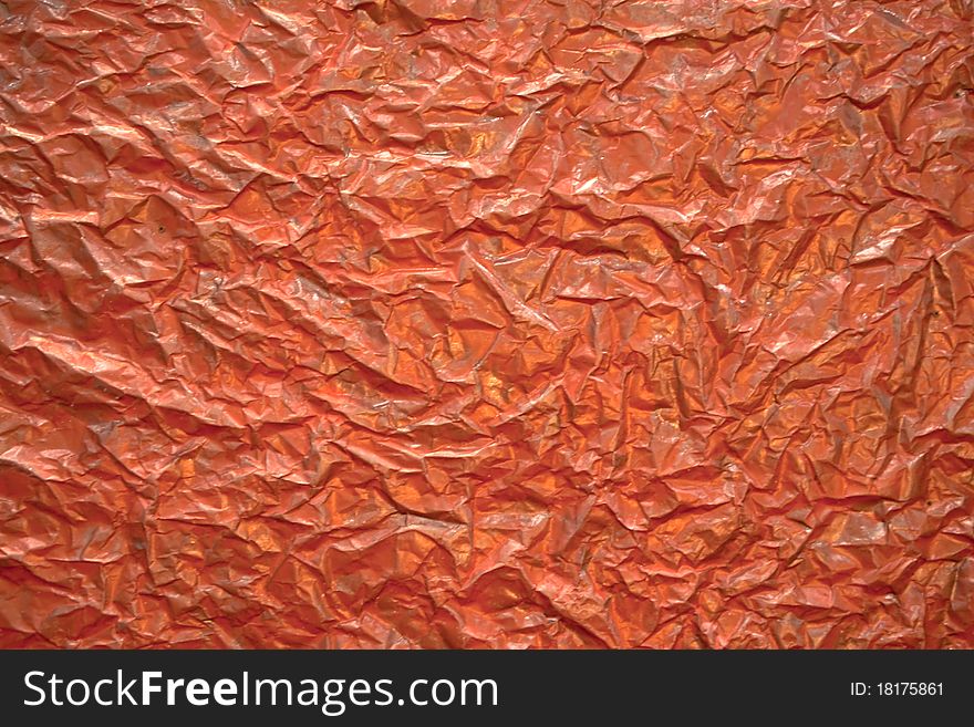 Red wrinkled foil surface