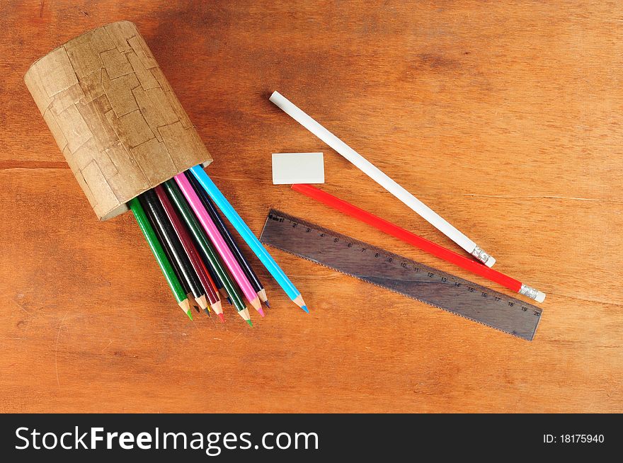 Variety of color pencils on wooden desk. Variety of color pencils on wooden desk.