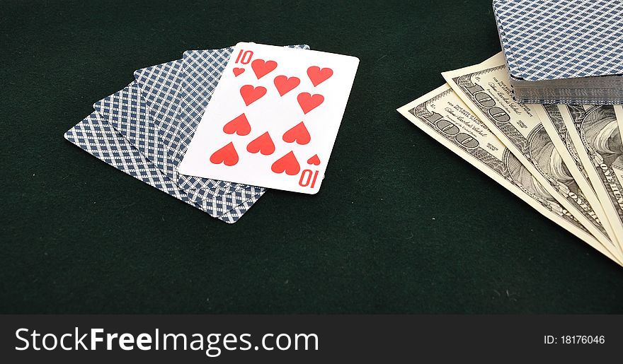 Poker cards on green felt