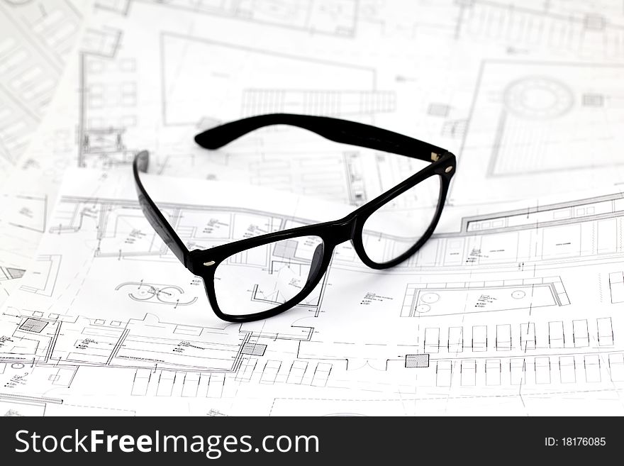 Black Glasses On The Architectural Blueprints