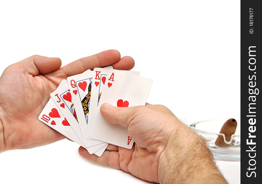 Man s hand lifting up playing cards