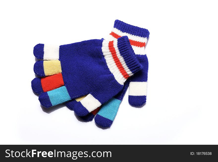 Winter colorful gloves on the white background