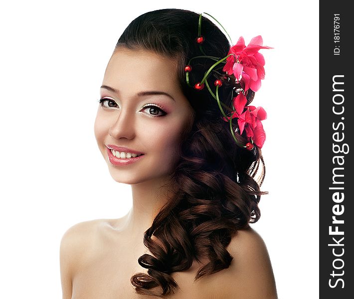 Girl with flower in her hair. White background