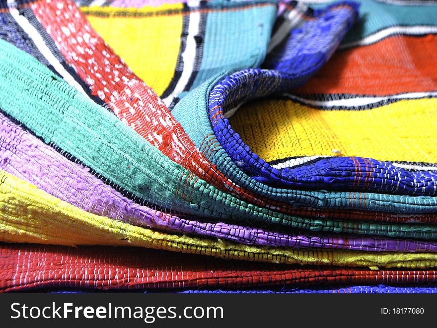 Colorful carpet handmade with red, yellow and blue strips. Colorful carpet handmade with red, yellow and blue strips