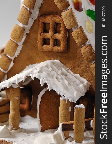 Fragment of gingerbread house entrance with the door open under the canopy. Fragment of gingerbread house entrance with the door open under the canopy