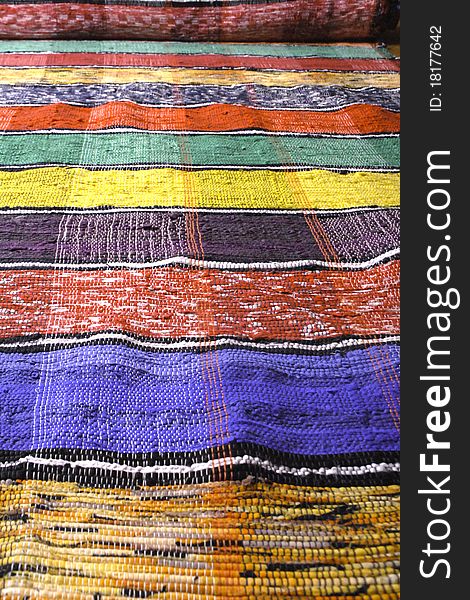 Colorful carpet handmade with red, yellow and blue strips. Colorful carpet handmade with red, yellow and blue strips