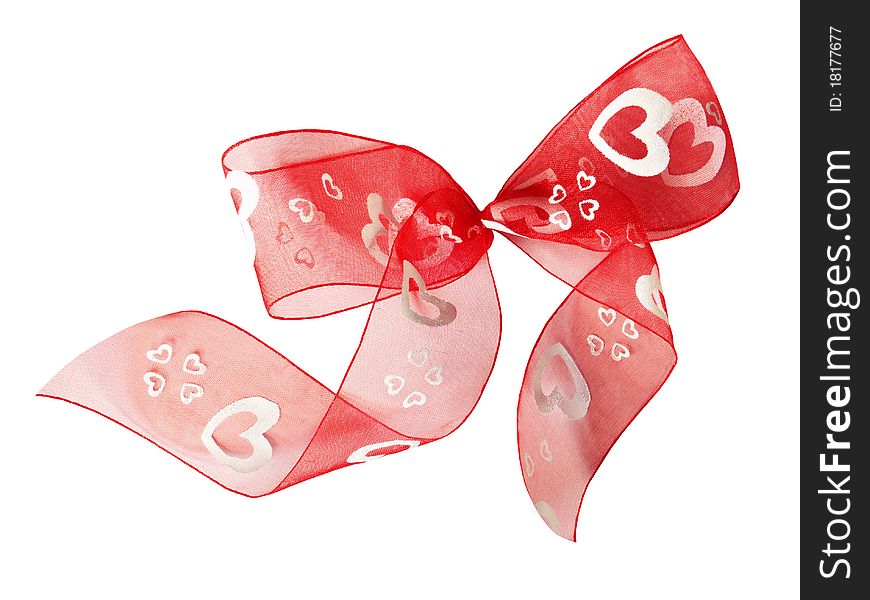 Red ribbon bow with white hearts isolated on white background with clipping path