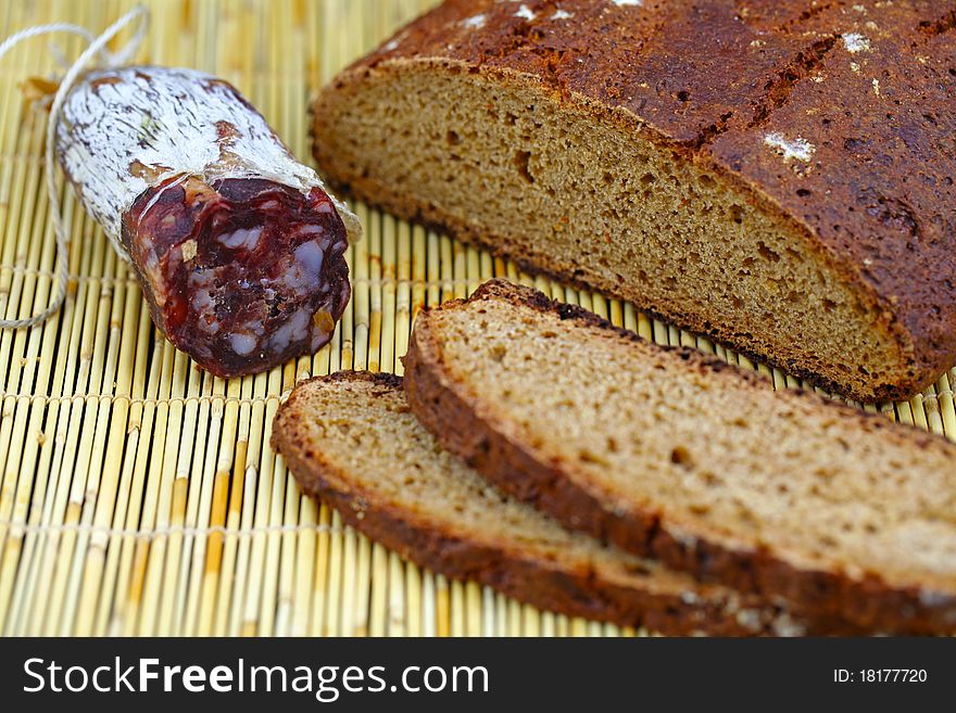 Salami sausage with homemade whole wheat bread sliced