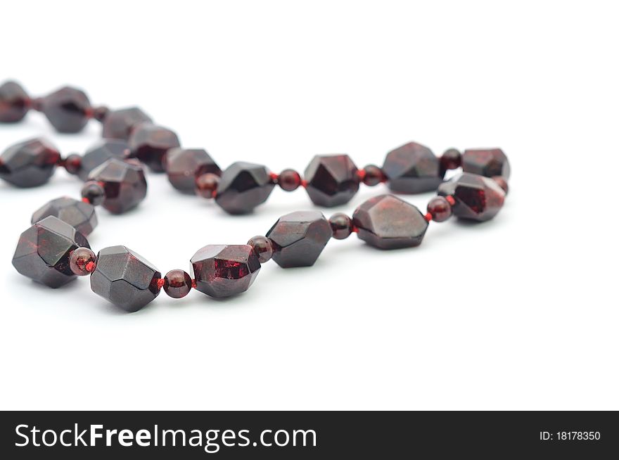 Garnet necklace isolated on a white background