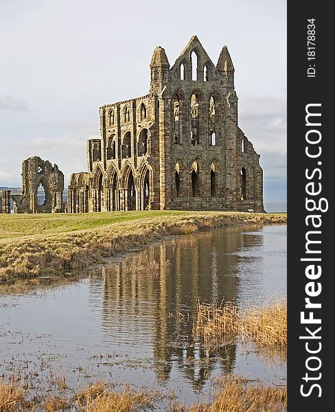 Ancient English Abbey With Reflection