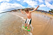 Boy Has Fun At The Beach Stock Photo