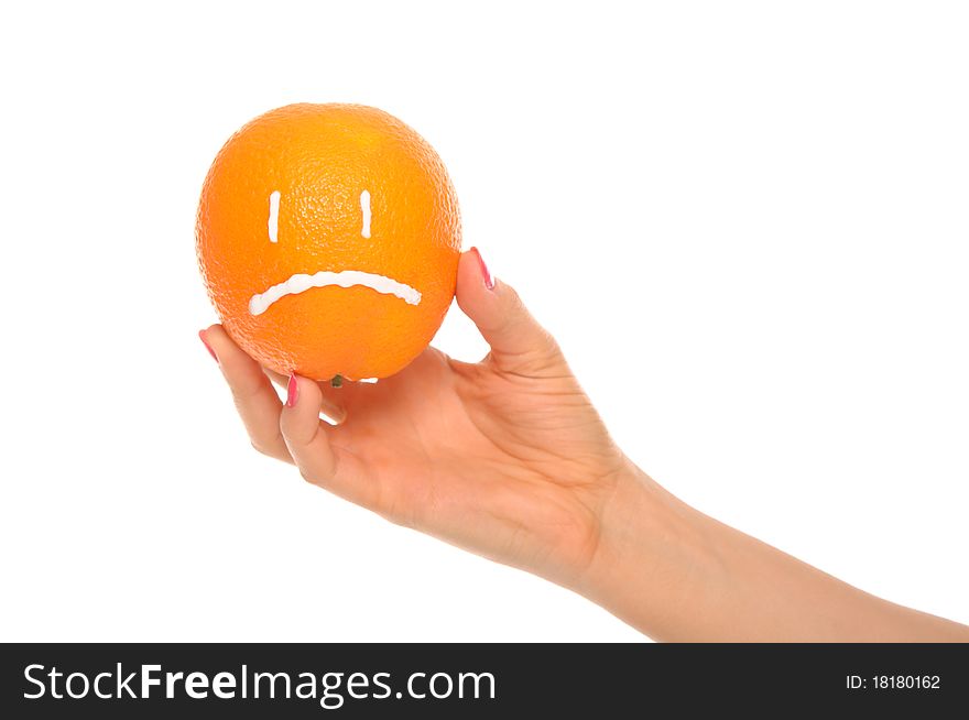 Hand holds orange with drawn insult isolated in white