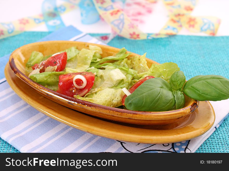 A fresh romana salad with tomatoes. A fresh romana salad with tomatoes