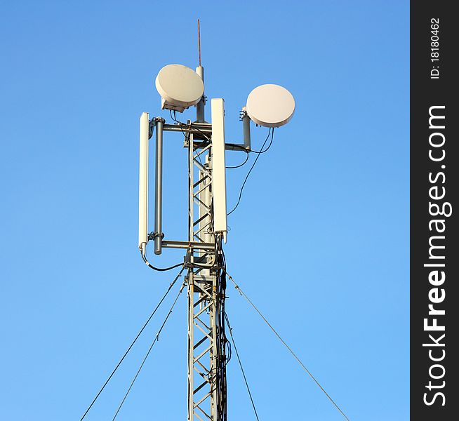 Aerial mobile communication  against the blue sky