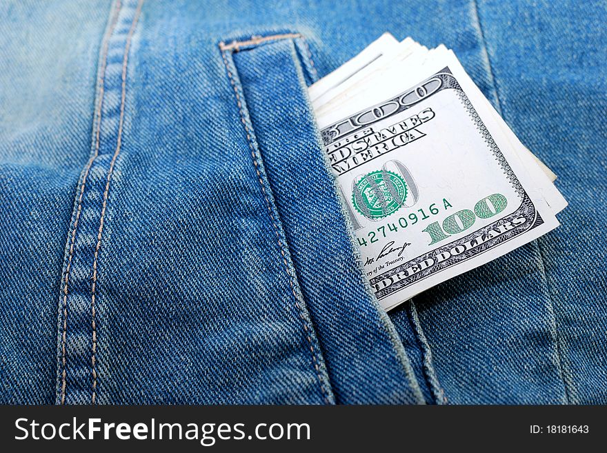 Lot of dollars in a pocket of jeans jacket.