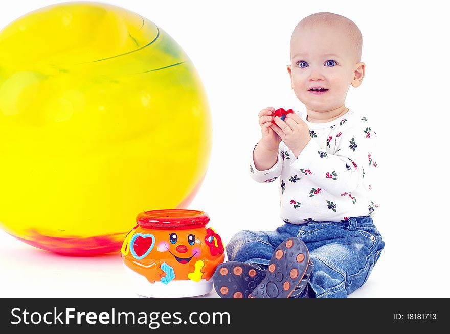 near a large yellow ball.On a white background. near a large yellow ball.On a white background.