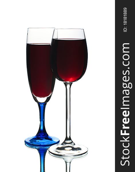 Two wineglasses filled with red wine.