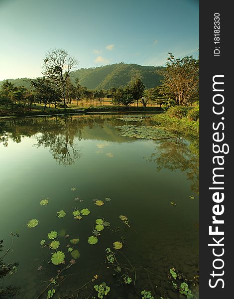 A small lake nearby mountain called Kao Yai, Thailand. Kao Yai is a national park located in Northeastern of Thailand. A small lake nearby mountain called Kao Yai, Thailand. Kao Yai is a national park located in Northeastern of Thailand