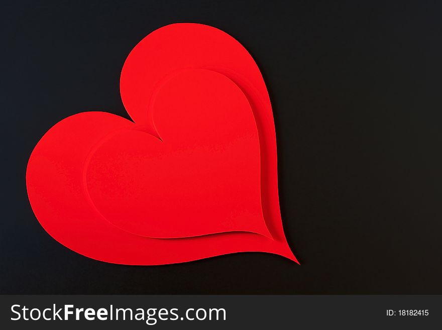 Red hearts isolated in a black background