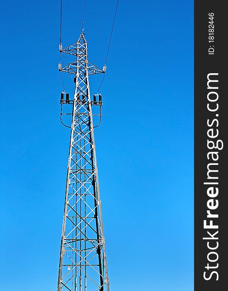 Tower of high voltage electric power with blue sky as background