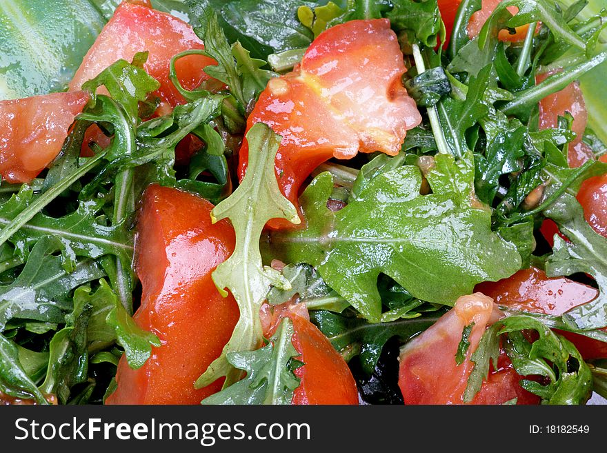 A salad with red tomato