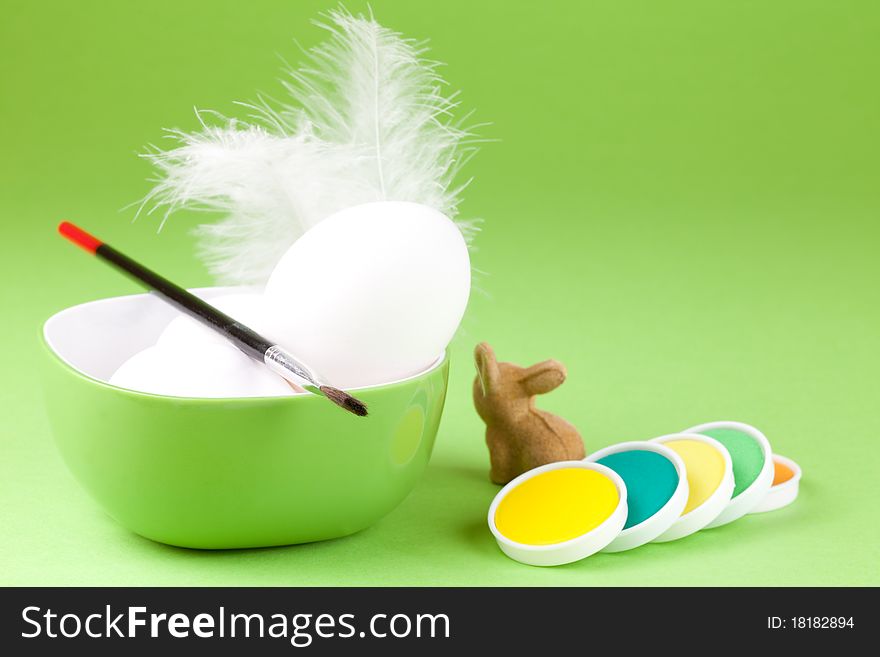 White eggs in a bowl with colors. White eggs in a bowl with colors