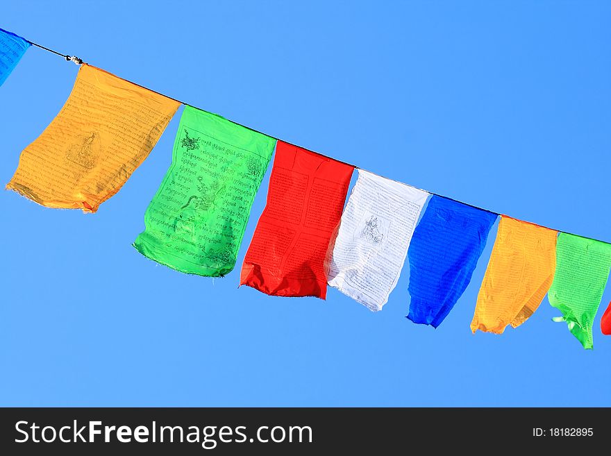 Prayer flags on blue sky background