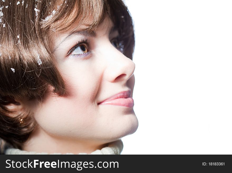 Young beautiful girl rejoices to snow, On a dark blue background