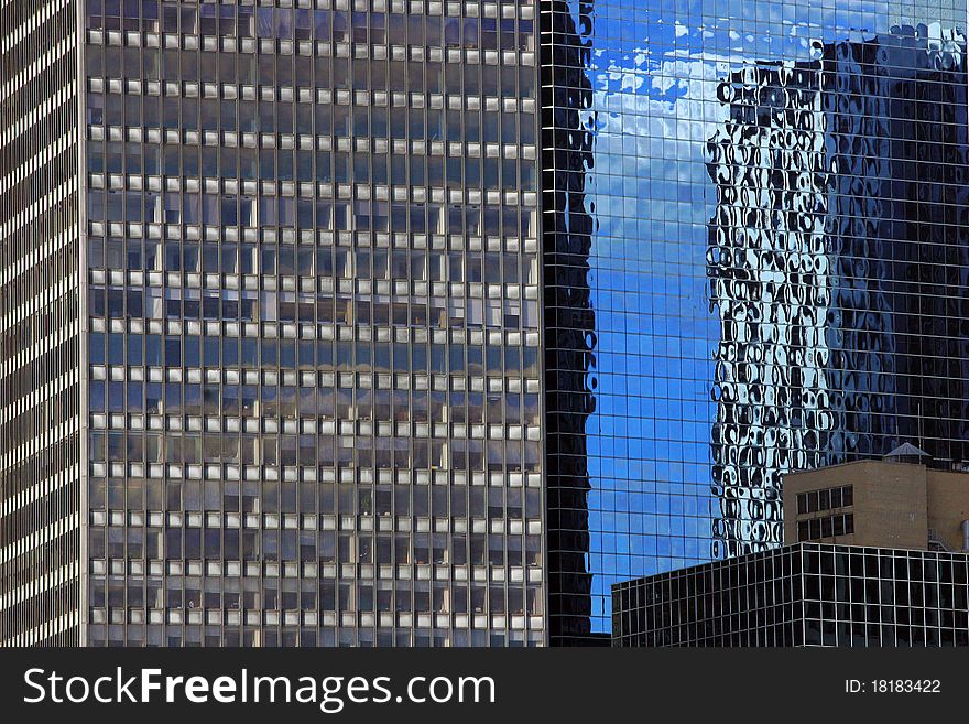 Manhattan New York City modern building reflection in the glass facade of the house.